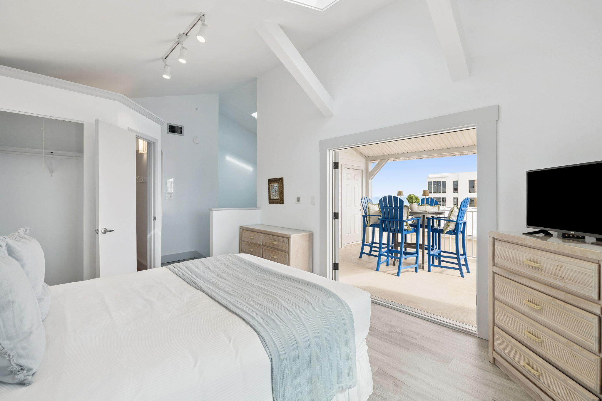 448 West Park Pl Avenue, Unit A2 Inlet Beach, FL 32461 - Photo 30 of 54 a bedroom with a bed and a flat screen tv