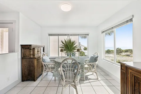 a view of a dining room with furniture window and outside view