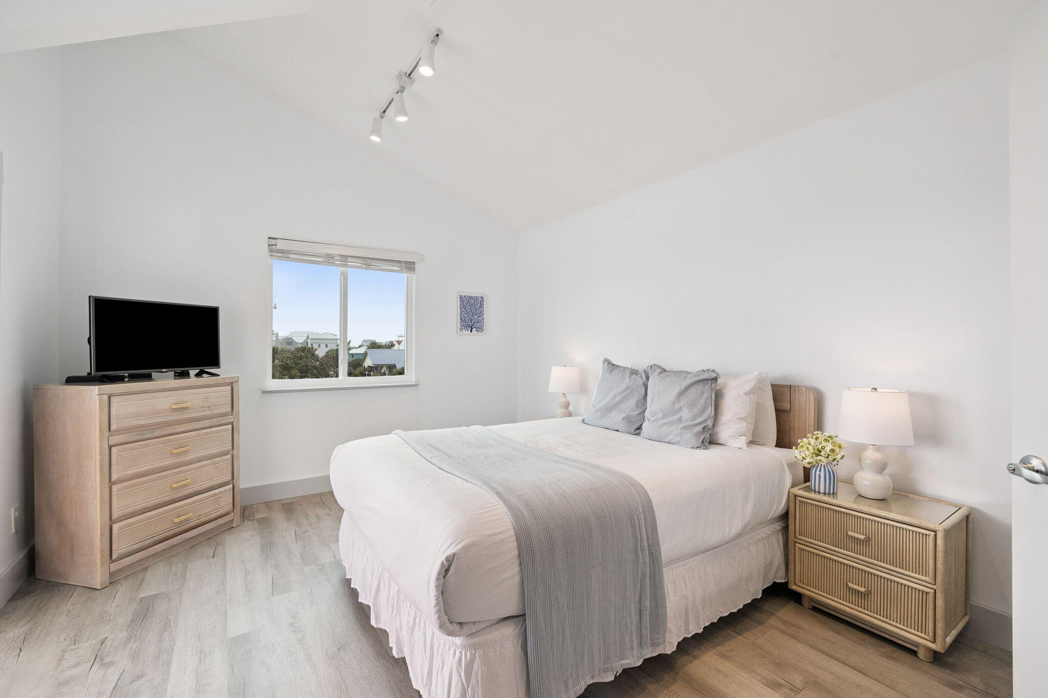 448 West Park Pl Avenue, Unit A2 Inlet Beach, FL 32461 - Photo 31 of 54 a bedroom with a bed and a flat screen tv