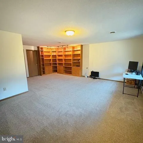 a kitchen with a sink appliances and cabinets