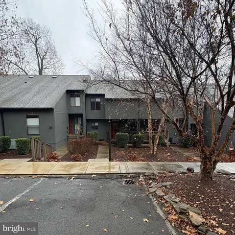 a front view of a building with sitting area