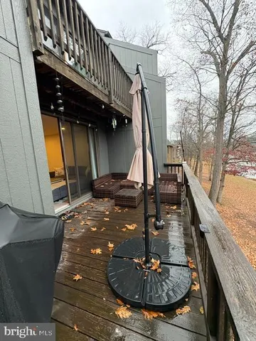 a view of a balcony with furniture