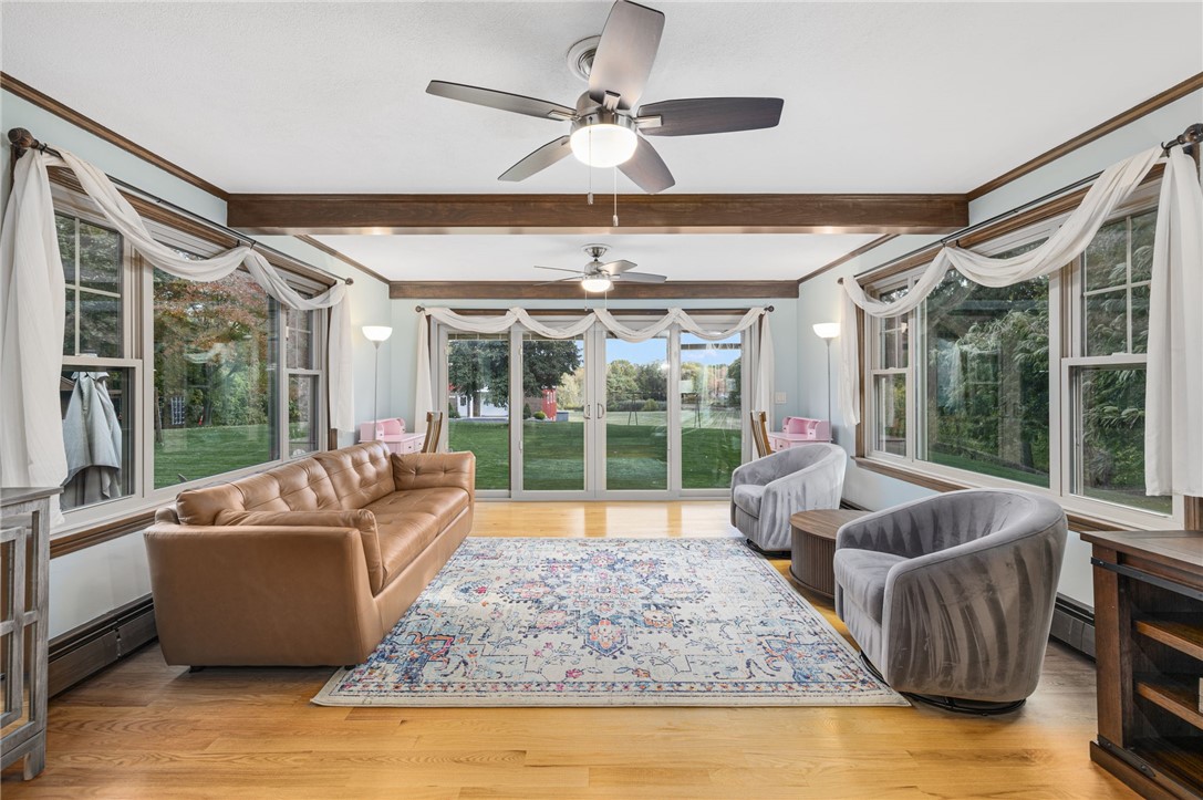 365 West Wrentham Road Cumberland, RI 02864 - Photo 15 of 50 Family room/Den includes 3 walls of oversized windows and doors. Lots of beautiful views (and wild life!)