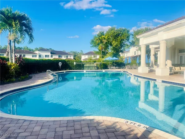 a view of a swimming pool with a patio