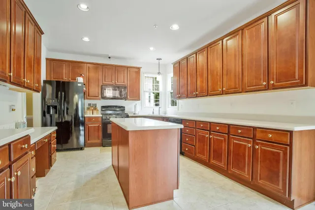 a view of a livingroom with workspace and a window