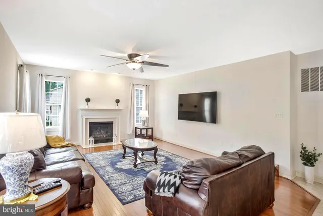 a bathroom with a sink vanity mirror and toilet