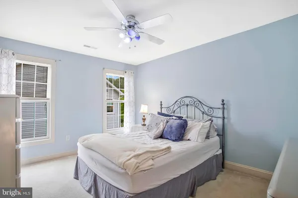 a bed room with a bed and a window