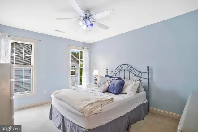 a bed room with a bed and a window