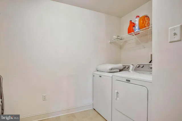 a bedroom with furniture and a flat screen tv