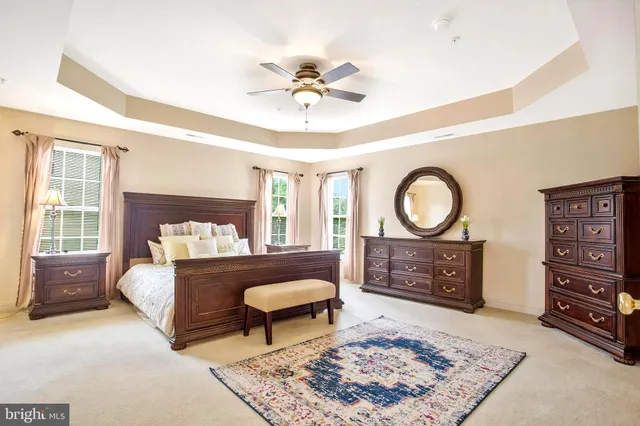 a view of a kitchen with furniture and a refrigerator
