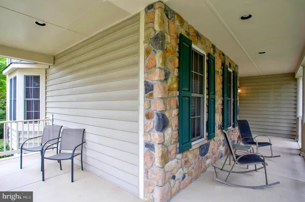 a view of an entryway with wooden floor and door