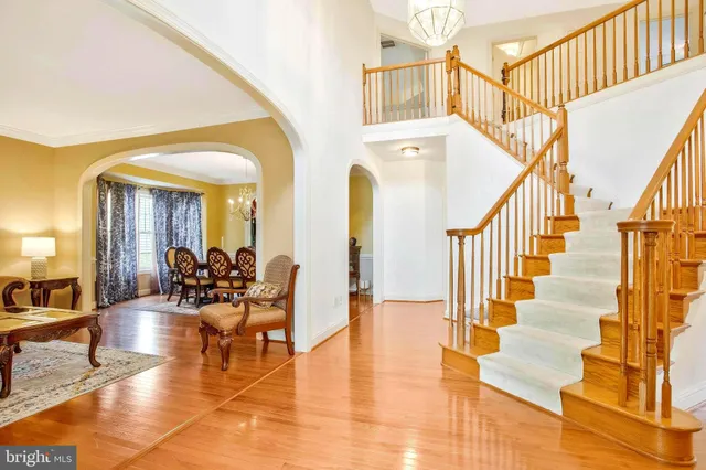 a kitchen with stainless steel appliances granite countertop a refrigerator a sink dishwasher and wooden cabinets