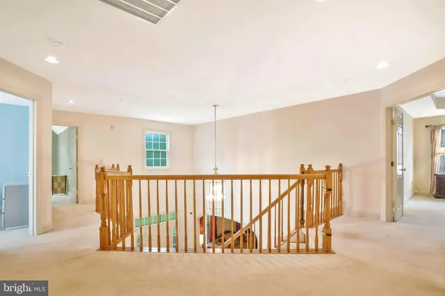 a living room with furniture and windows