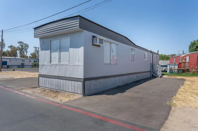 a view of a house with a street