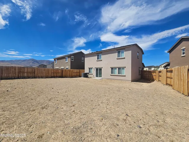 a view of a house with a snow in the yard