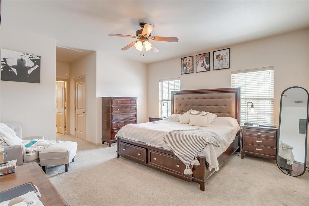 383 County Road 3672 Springtown, TX 76082 - Photo 12 of 39 Bedroom with attic access, light carpet, and a ceiling fan