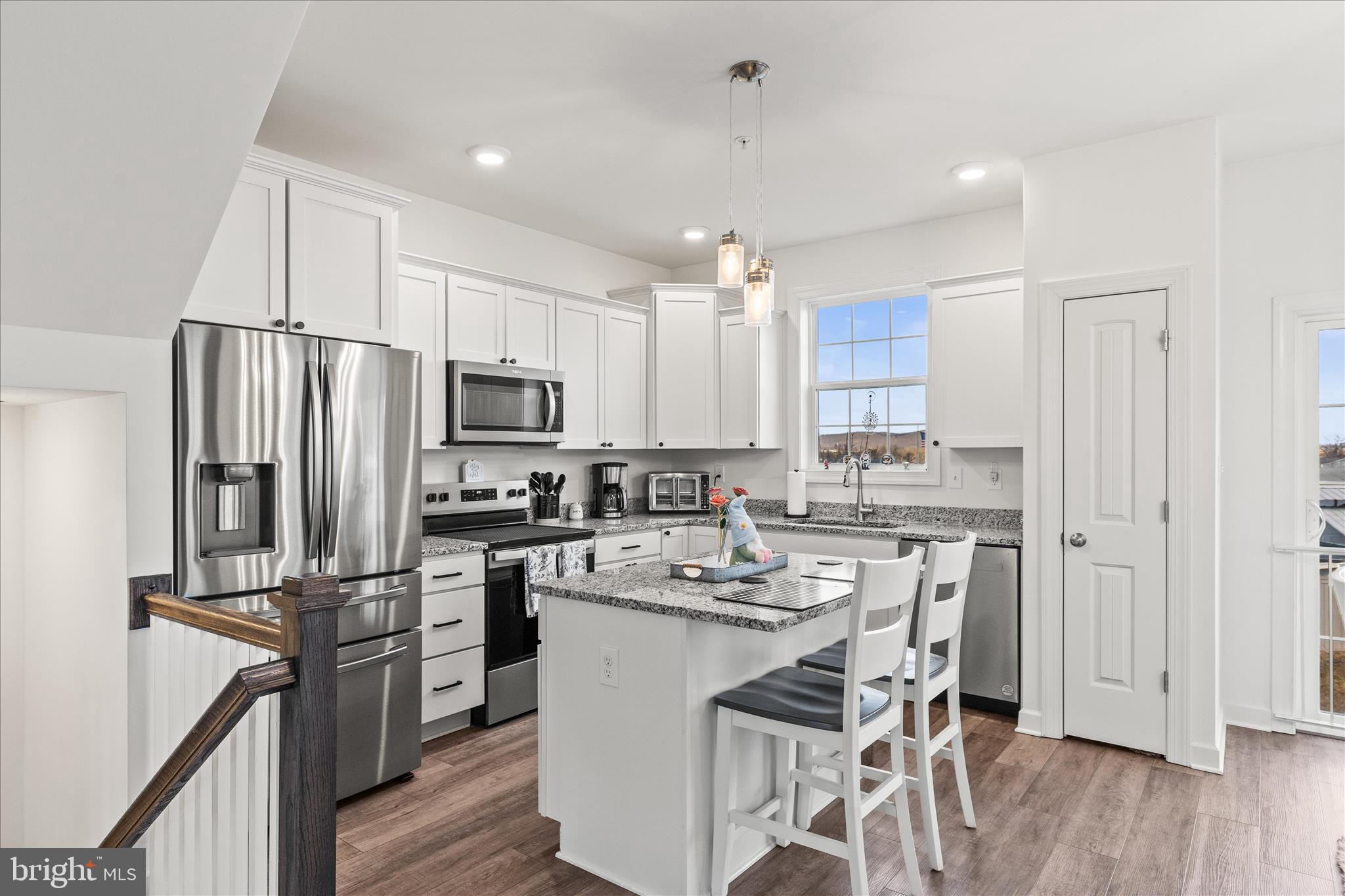101 Overlook Dr. Hanover, PA 17331 - Photo 11 of 38 a kitchen with kitchen island granite countertop a center island stainless steel appliances cabinets and a wooden floor