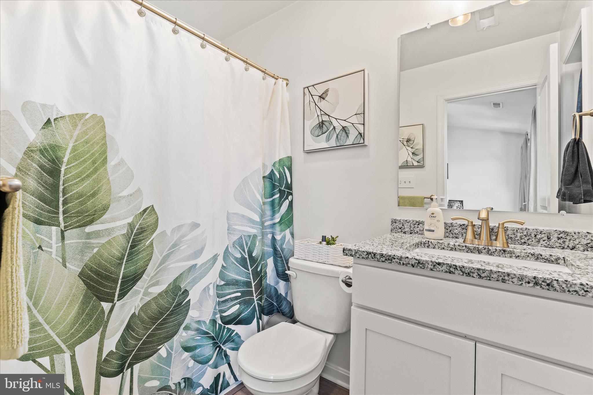 101 Overlook Dr. Hanover, PA 17331 - Photo 22 of 38 a bathroom with a granite countertop toilet and a mirror