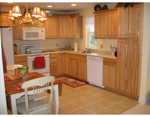 a kitchen with a sink cabinets and window