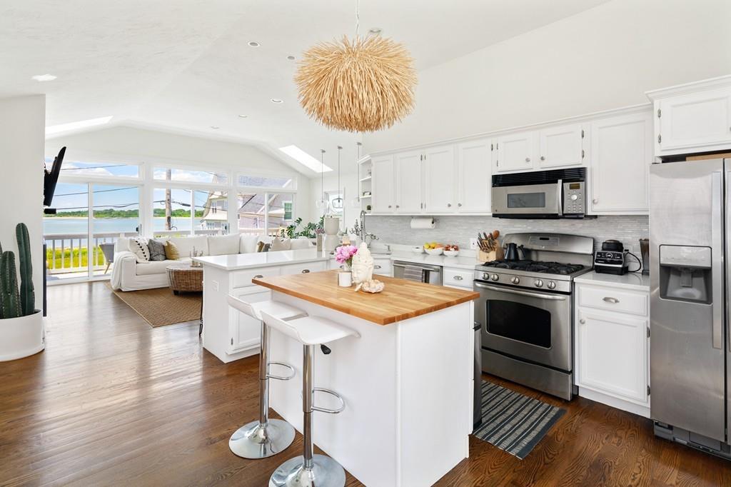 5 Beach Lane Hingham, MA 02043 - Photo 3 of 32 a kitchen with a sink cabinets and wooden floor
