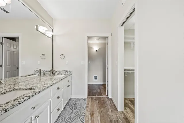 a bathroom with a shower and a mirror