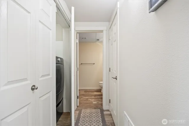 a bathroom with a granite countertop sink mirror vanity and toilet