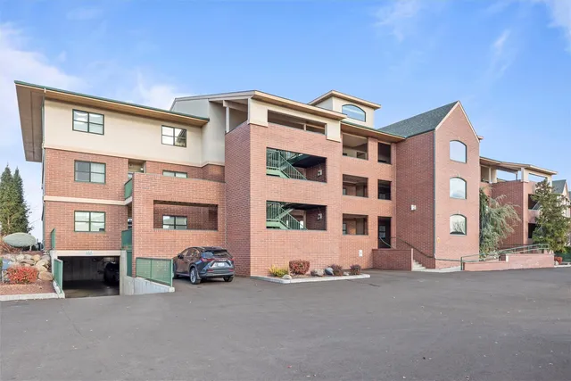 a view of building with parking area