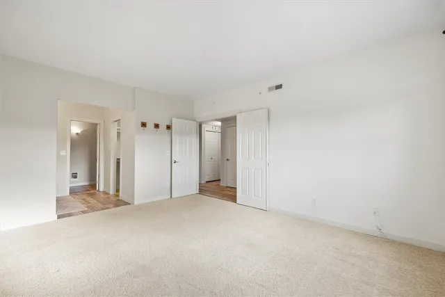 a bathroom with double sink and a mirror