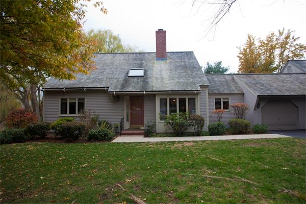 69 Potter Pond, Unit 69 Lexington, MA 02421 - Photo 1 of 1 a front view of a house with garden