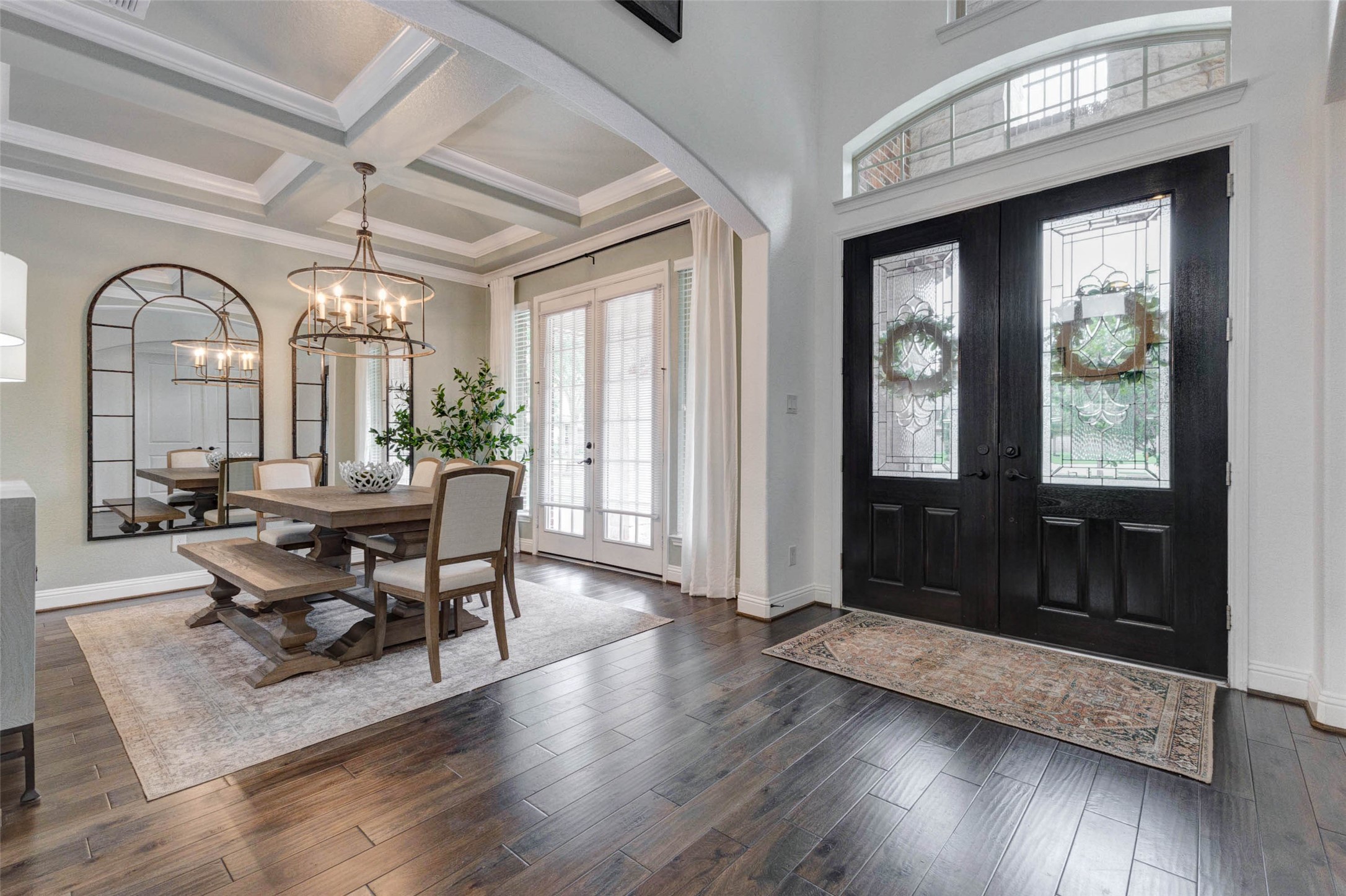 29903 Spring Side Court Fulshear, TX 77406 - Photo 6 of 50 a dining room with wooden floor a glass table and chairs
