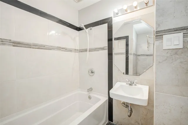 a bathroom with a sink and a bathtub