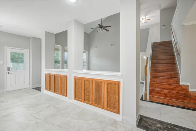 a view of a bathroom with tub and windows