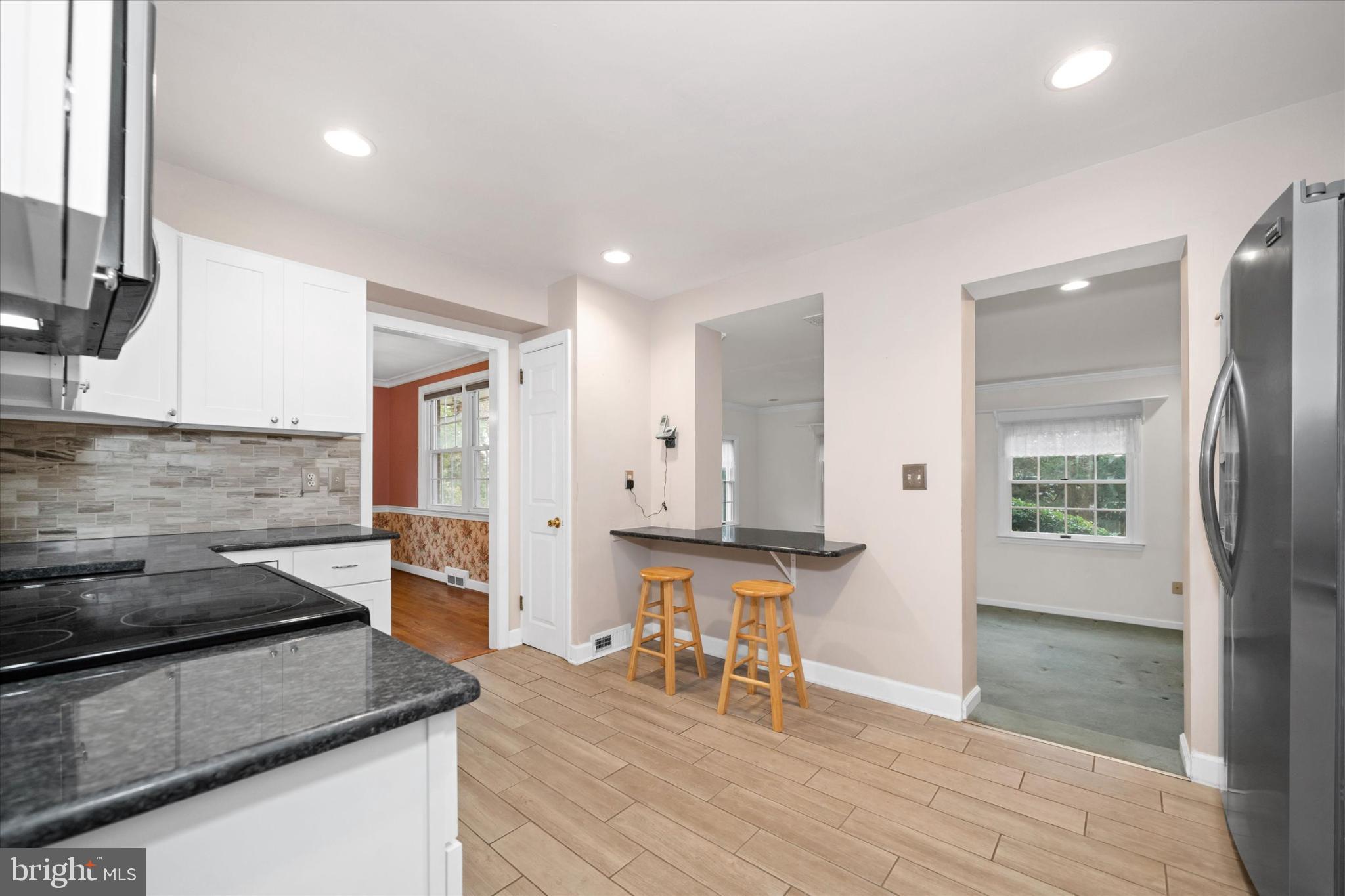 42 Paschall Road Wilmington, DE 19803 - Photo 13 of 41 a kitchen with stainless steel appliances granite countertop a stove and a sink