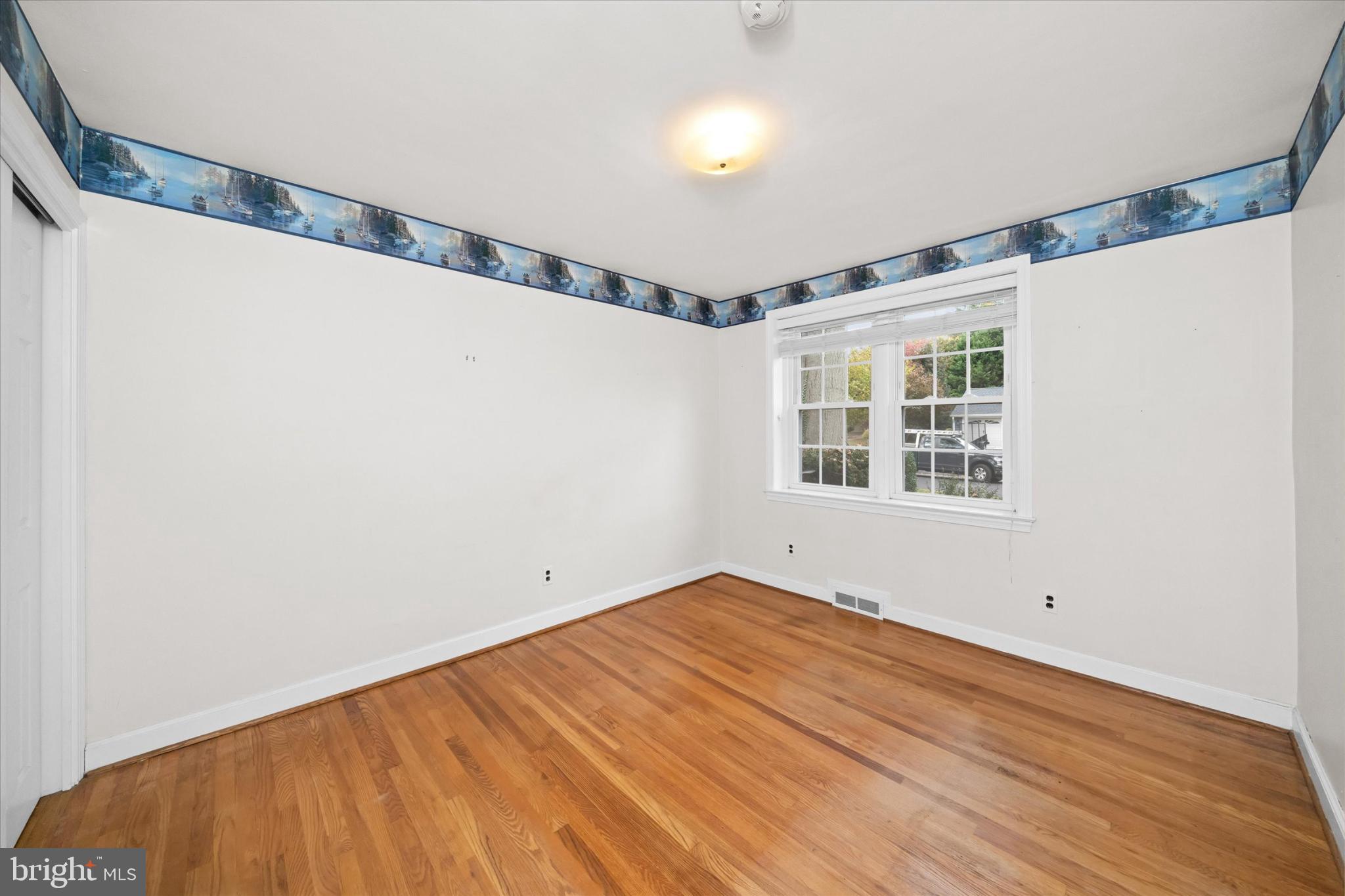 42 Paschall Road Wilmington, DE 19803 - Photo 17 of 41 a view of a big room with wooden floor and windows in a room