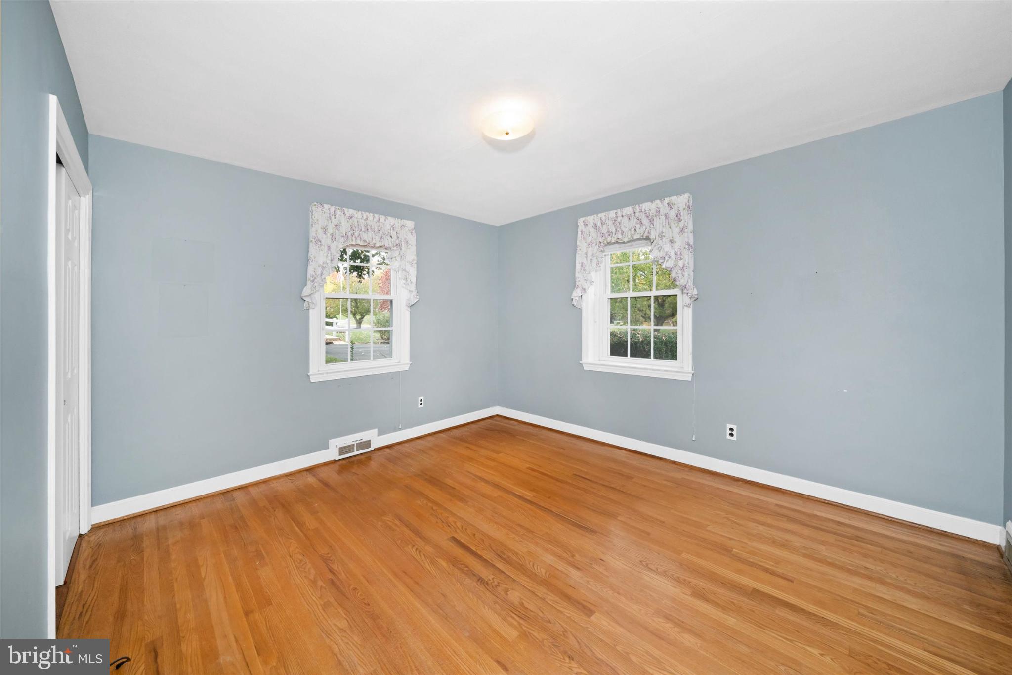 42 Paschall Road Wilmington, DE 19803 - Photo 19 of 41 a view of an empty room with wooden floor and a window