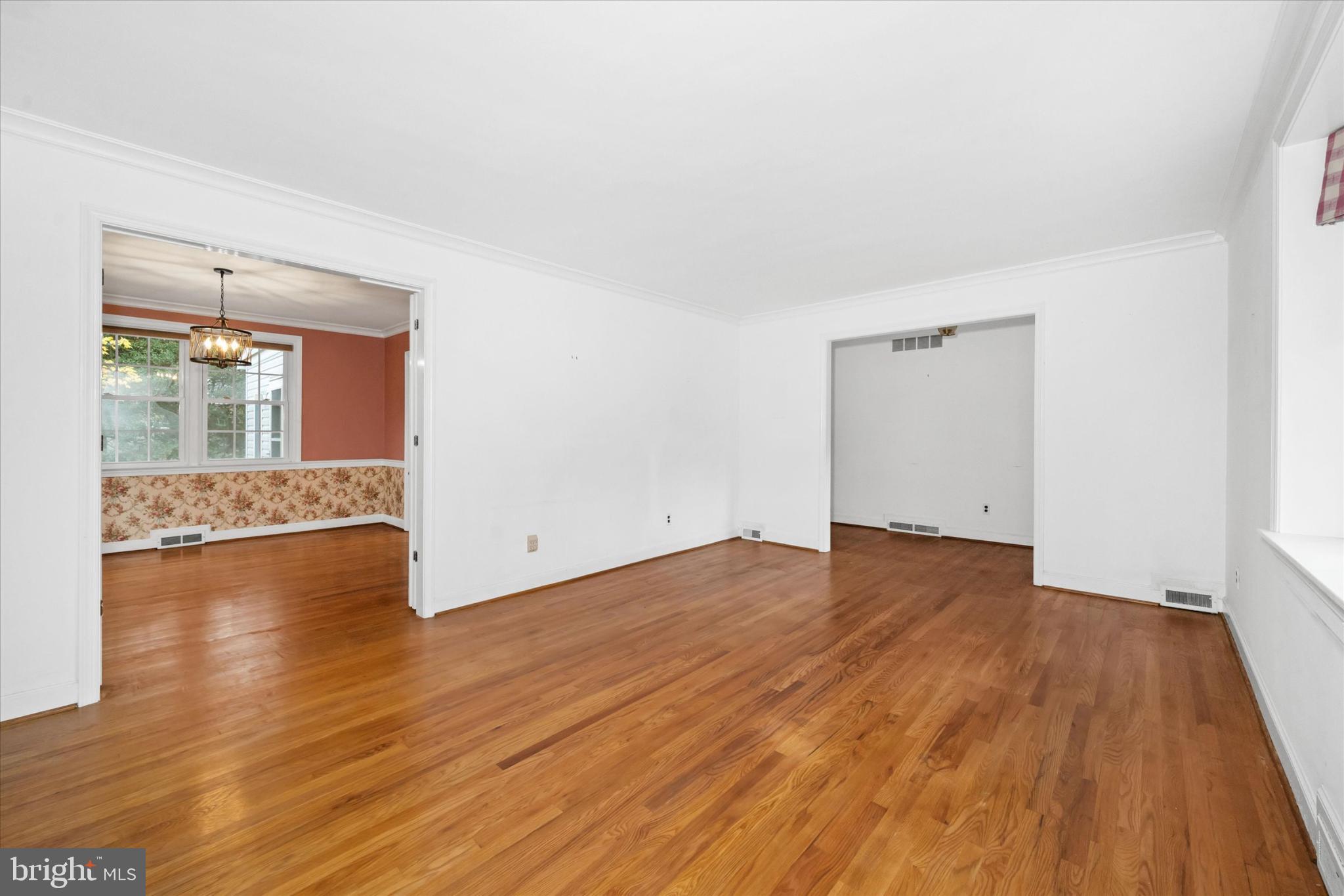 42 Paschall Road Wilmington, DE 19803 - Photo 6 of 41 an empty room with wooden floor and windows