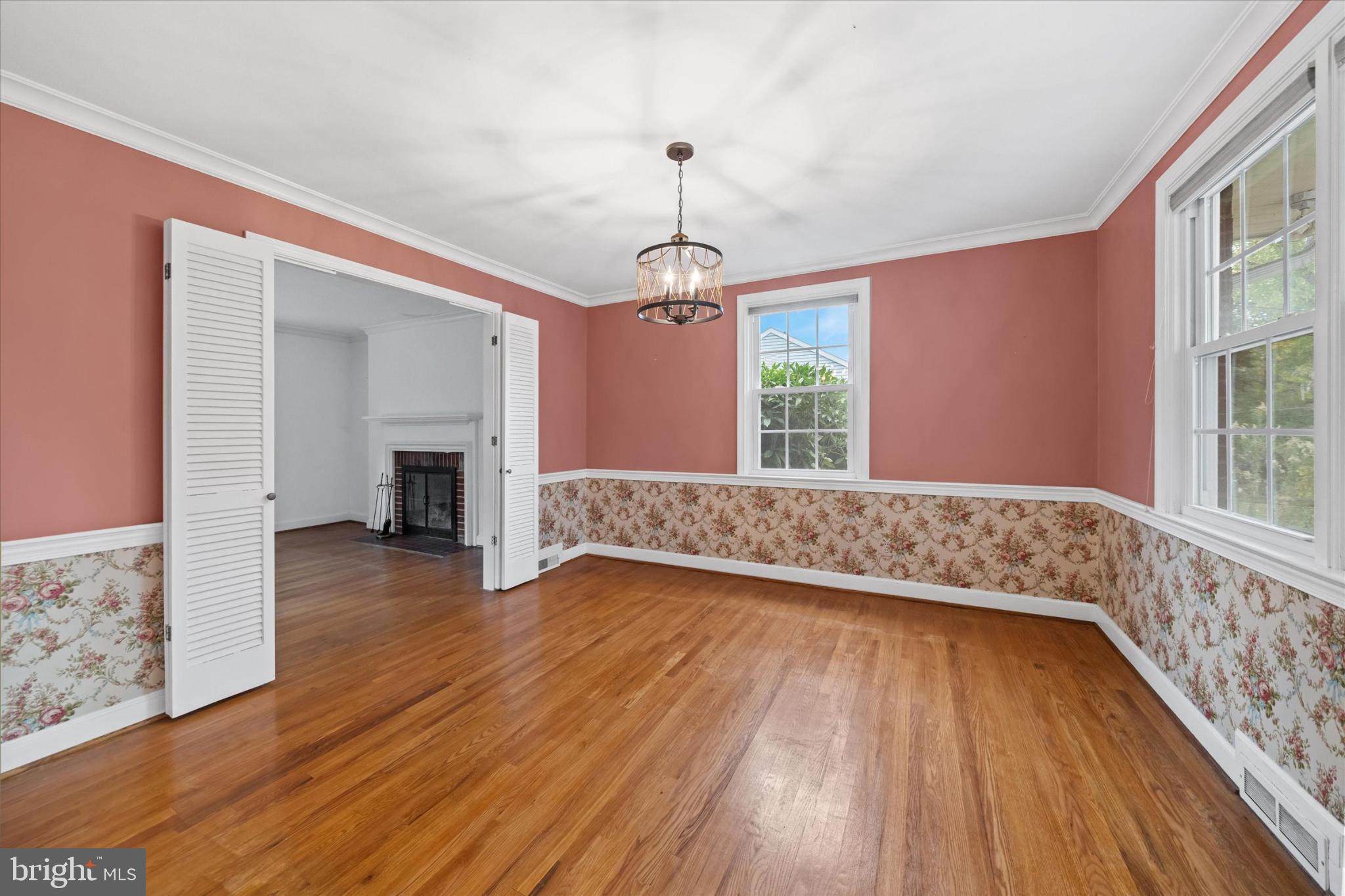 42 Paschall Road Wilmington, DE 19803 - Photo 7 of 41 a view of an empty room with wooden floor and a window