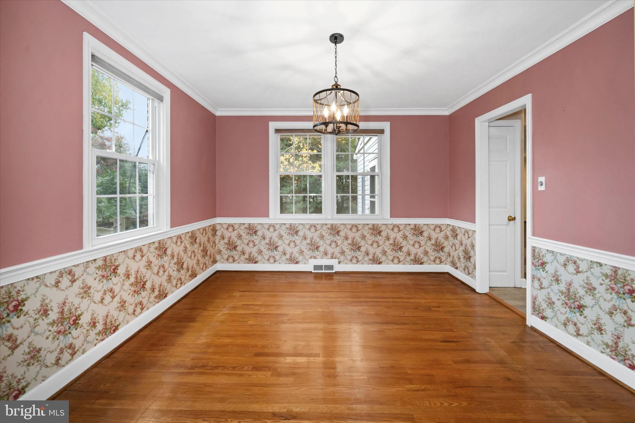 42 Paschall Road Wilmington, DE 19803 - Photo 8 of 41 a view of an empty room with wooden floor and a window