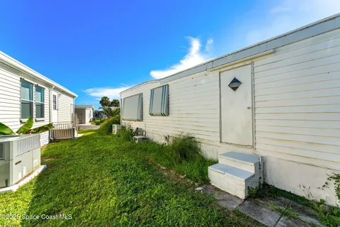 a house view with a backyard space