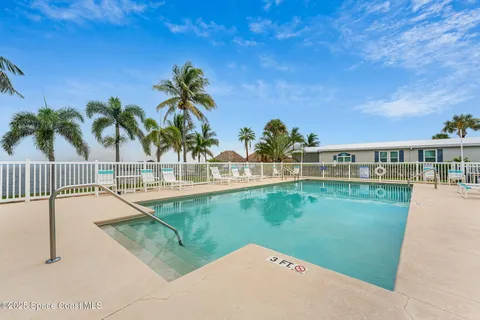 a view of swimming pool with outdoor seating and deck
