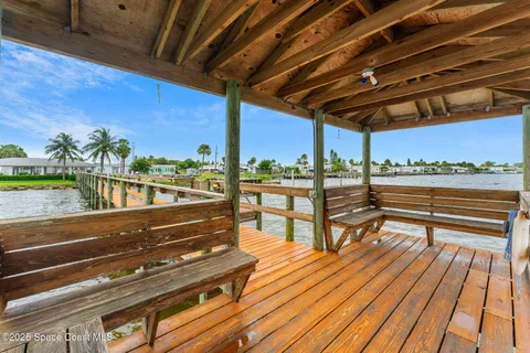 a view of a balcony with wooden floor