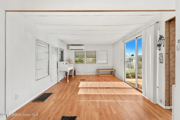 a very nice looking room with a large window and chair