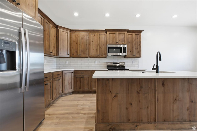 164 North 400 East Preston, ID 83263 - Photo 6 of 21 Kitchen featuring wood-finish cabinetry, white countertops, and stainless steel appliances