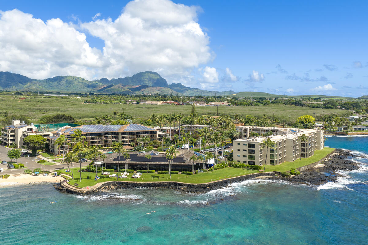 5061 Lawai Road, Unit 402 Koloa, HI 96756 - Photo 26 of 30 a view of a lake with houses in back