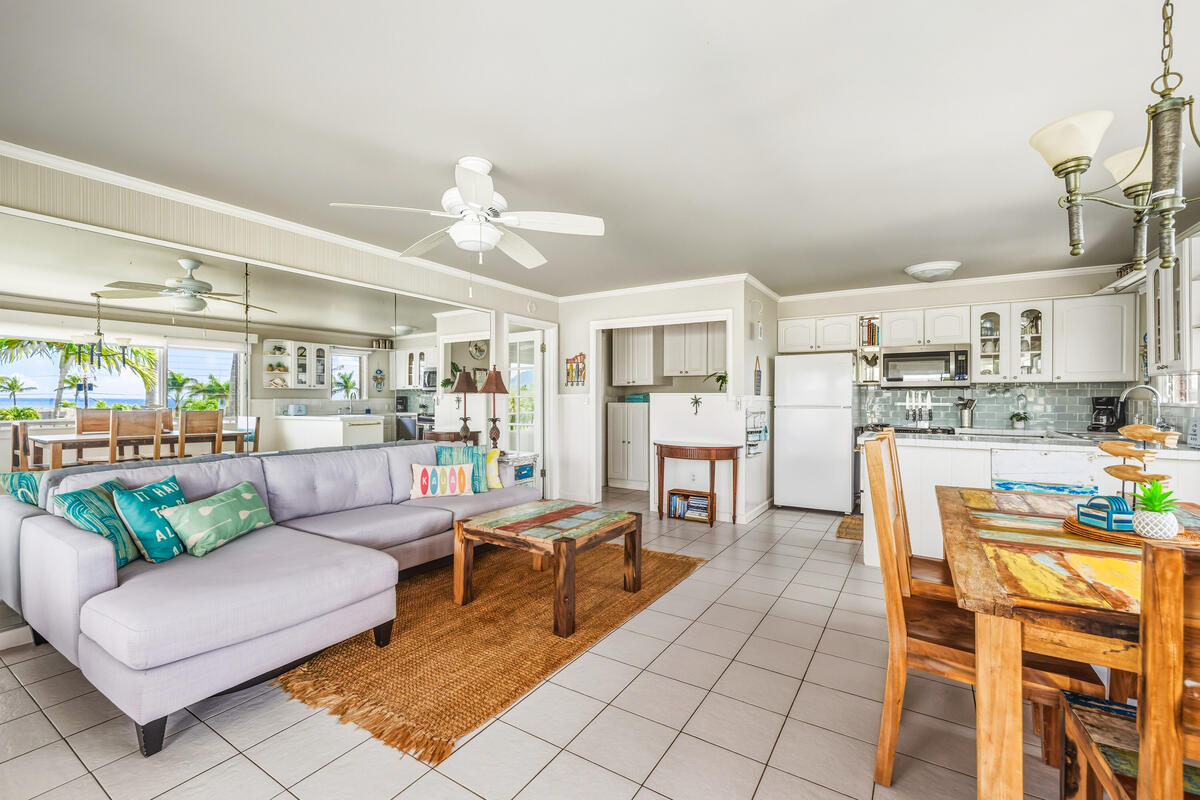 5061 Lawai Road, Unit 402 Koloa, HI 96756 - Photo 5 of 30 a living room with lots of furniture and kitchen view