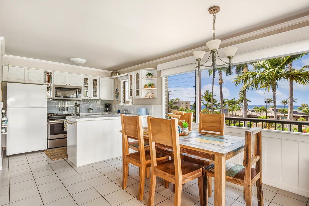 5061 Lawai Road, Unit 402 Koloa, HI 96756 - Photo 6 of 30 a dining room with furniture a kitchen and chandelier