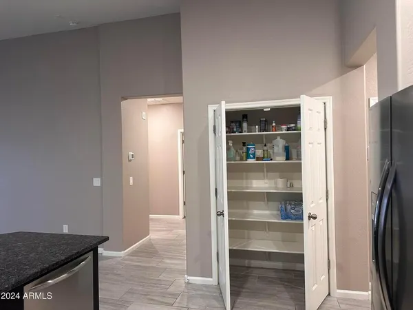 a view of a kitchen from the hallway