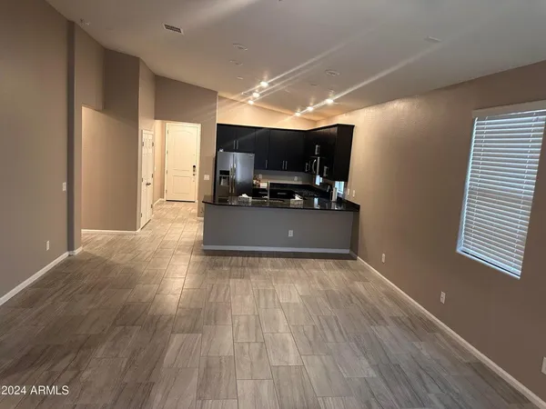 a view of kitchen with microwave and window
