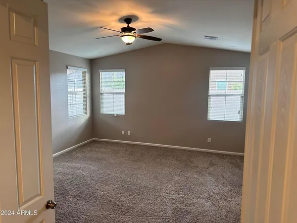 a view of an empty room with a window