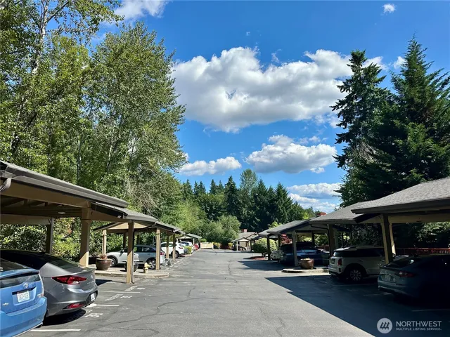 a view of street with parked cars